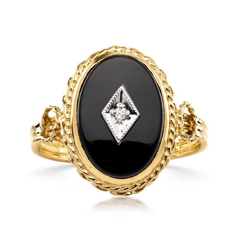 Vintage onyx ring in 14kt yellow gold with oval black stone and single diamond setting