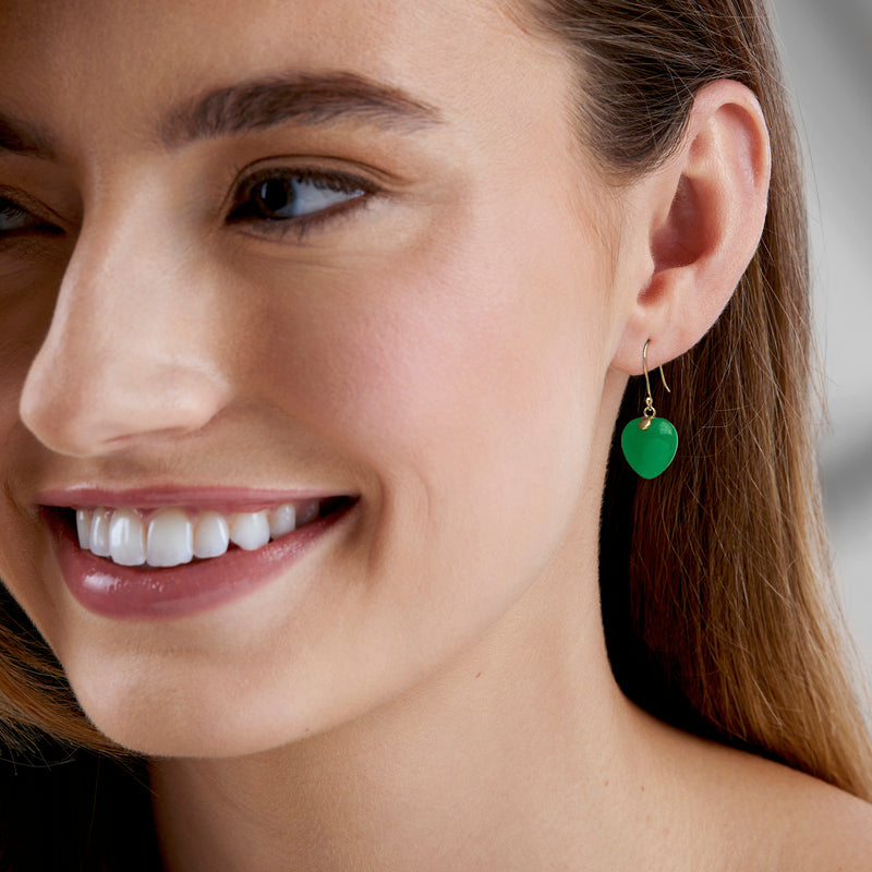 Green jade heart drop earrings on earwire hooks, shown on model