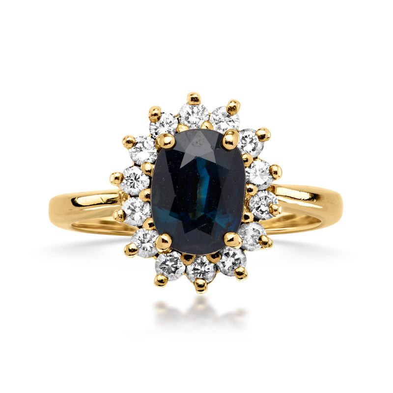 14kt yellow gold ring with dark oval sapphire and diamond halo, round accents