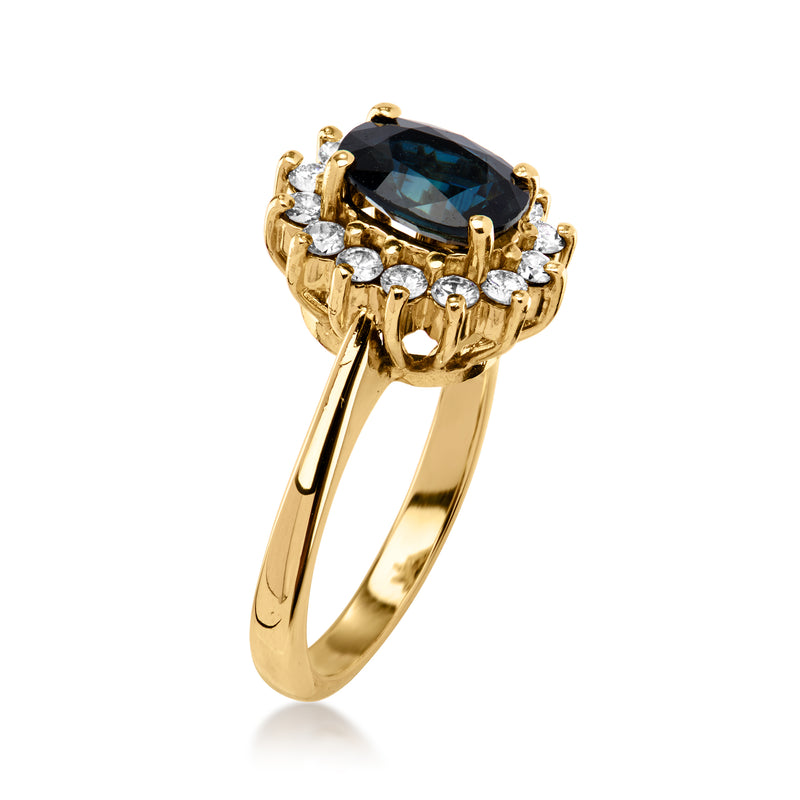 14kt yellow gold ring with oval dark sapphire center and prong set diamond accents