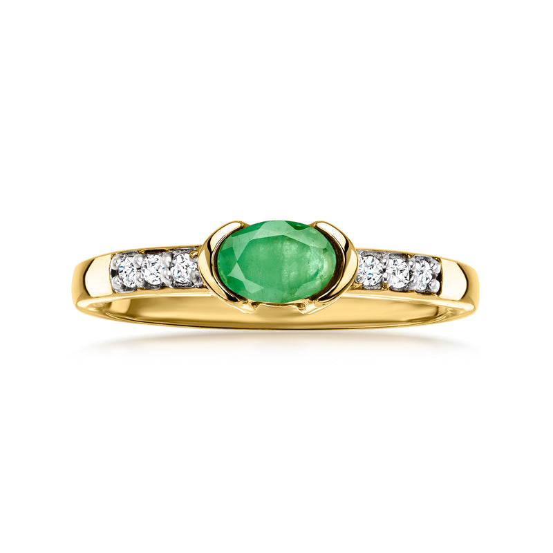 Gold over sterling ring with oval green gemstone center and white zircon side stones