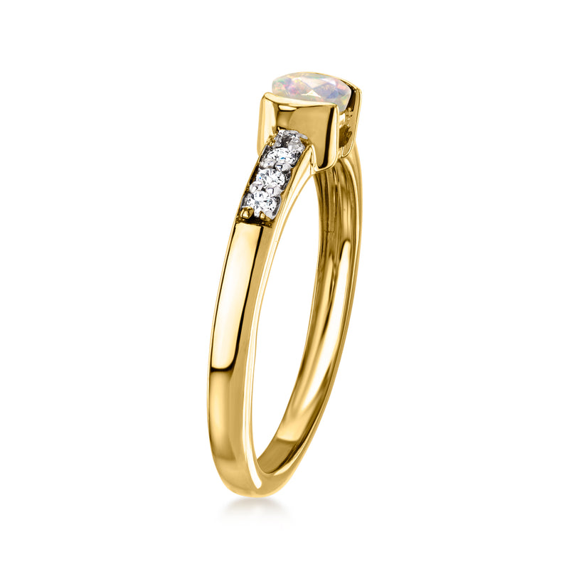 Gold-tone oval opal ring with white zircon side stones and slim band