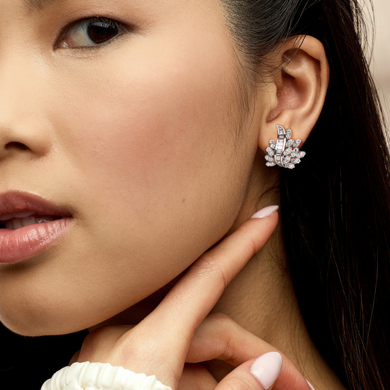 Diamond spray earrings in 14kt white gold on model's ear