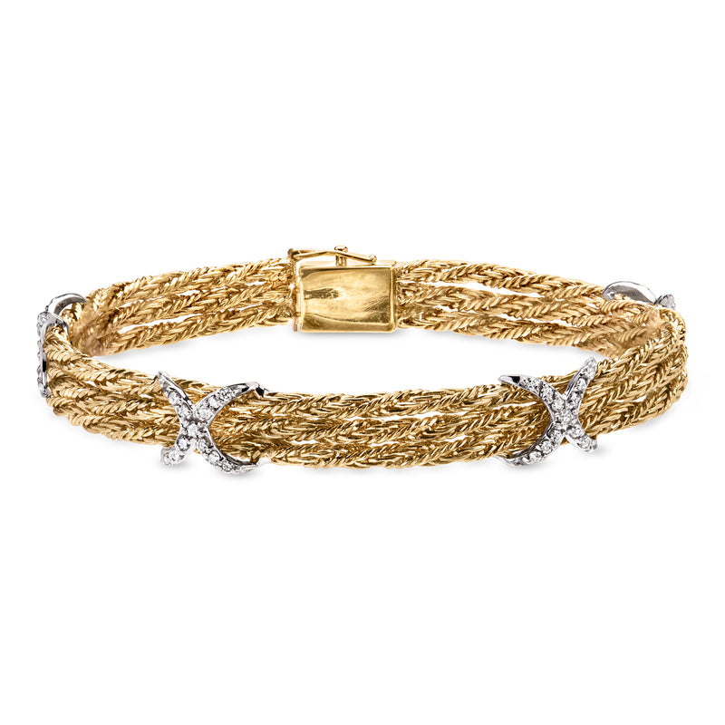 Two-tone gold braided diamond station bracelet with X-shaped stone accents