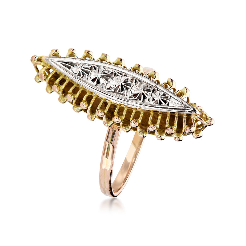 Two-tone gold navette ring angled view; engraved center with textured yellow prong setting