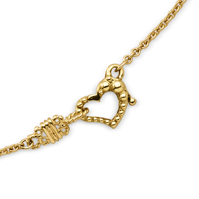 Two-tone gold diamond station necklace chain with clover motif connector detail