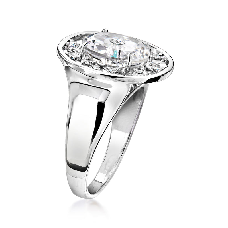 Vintage white gold ring side view with large clear gemstone center and diamond accents