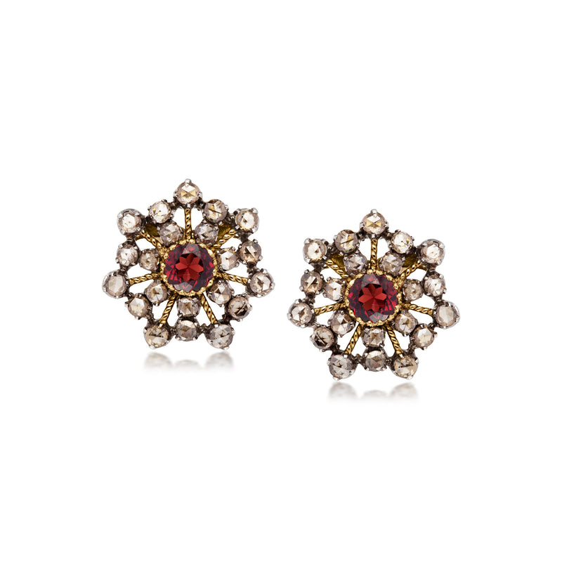 Snowflake earrings with garnet centers and diamond accents in gold over sterling