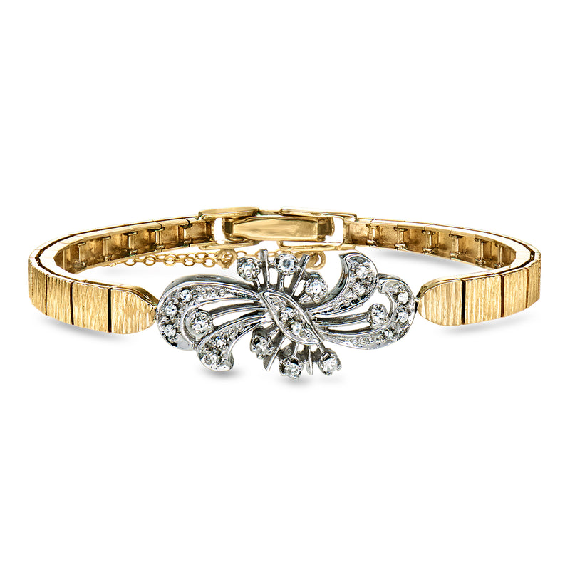 Vintage two-tone gold bracelet with diamond floral centerpiece and clasp