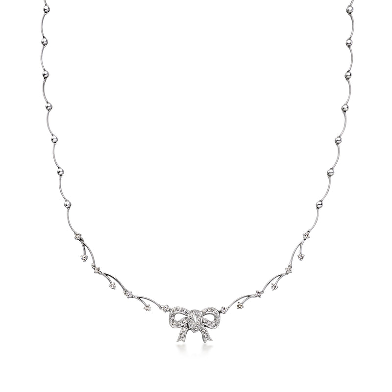 Diamond bow necklace in 14kt white gold, row of small stones and bow pendant