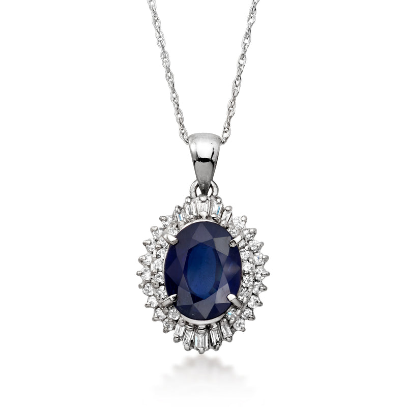 Platinum sapphire pendant necklace with oval blue stone and diamond halo