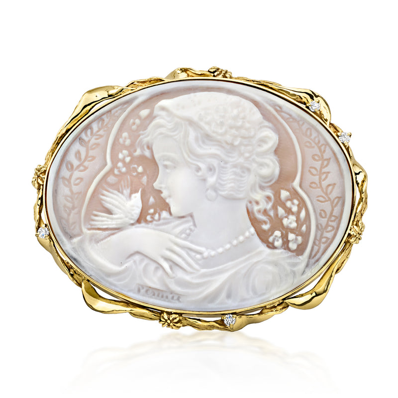 Oval shell cameo pin/pendant in 18kt yellow gold with diamond accents on frame