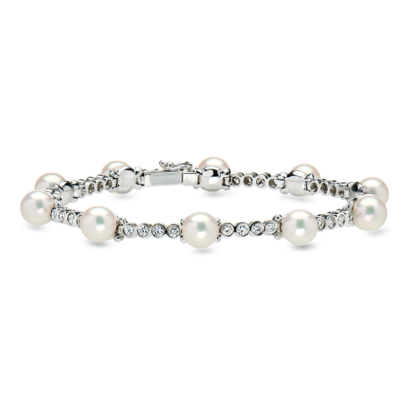 Cultured pearl and diamond tennis bracelet with round white pearls on silver links