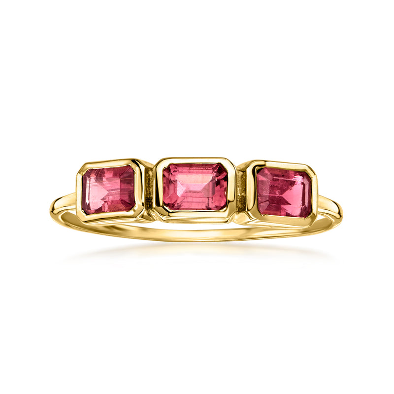 Three-stone pink tourmaline ring in 10kt yellow gold, cushion-cut stones