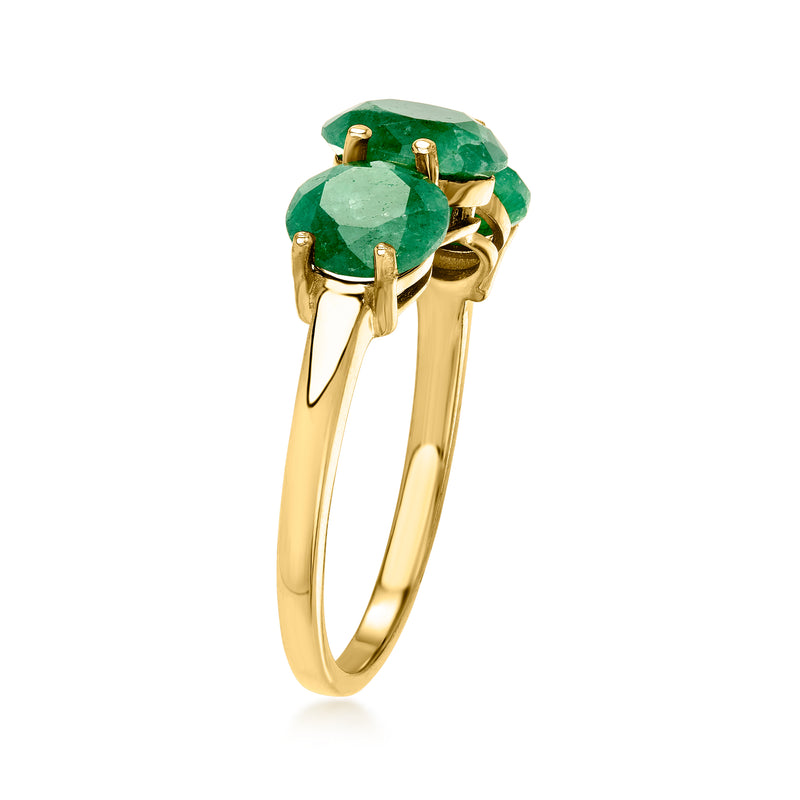 Gold-tone three-stone ring with large green gemstones, side profile prongs