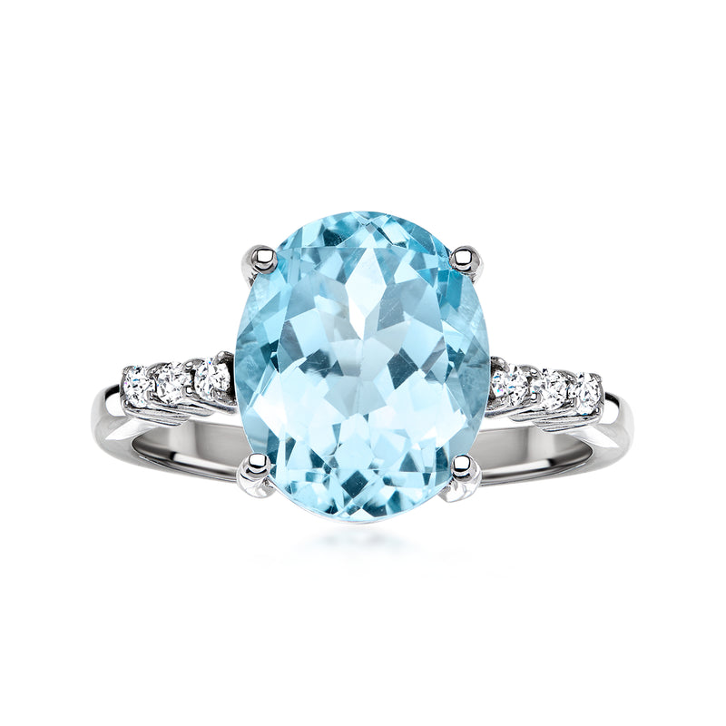 Sterling silver ring with oval sky blue topaz and small clear accents