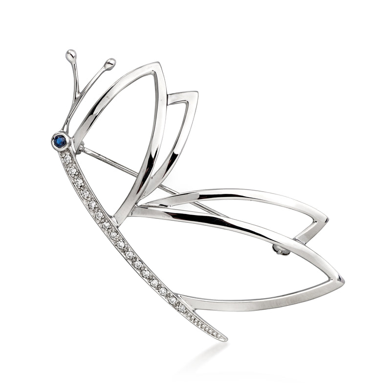 White gold butterfly pin with diamond accents and blue sapphire center