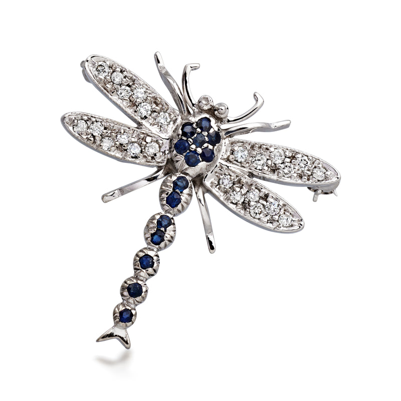 Dragonfly pin in 18kt white gold with sapphire body and diamond wings.