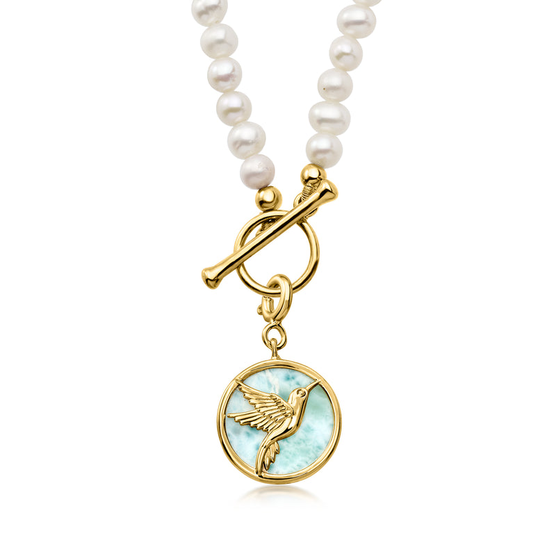 Blue larimar round charm with gold bird relief, on pearl bead necklace strand