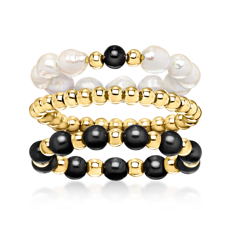 Three stretch rings: white cultured pearls, black onyx beads, and 10kt yellow gold accents