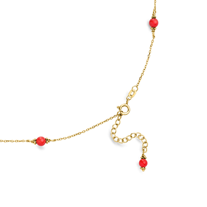 Yellow gold chain necklace with red coral station beads and teardrop drop