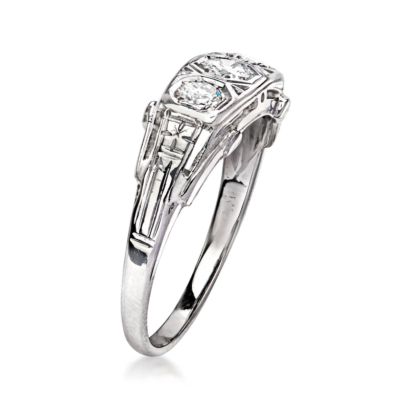 Vintage three-stone diamond ring, 18kt white gold with raised round center stone