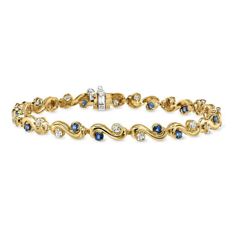 14kt yellow gold scroll bracelet with blue sapphires and white diamonds, hinged clasp