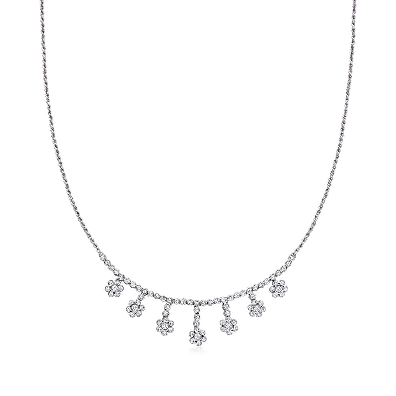 White gold diamond flower drop necklace with dangling flower charms along the chain