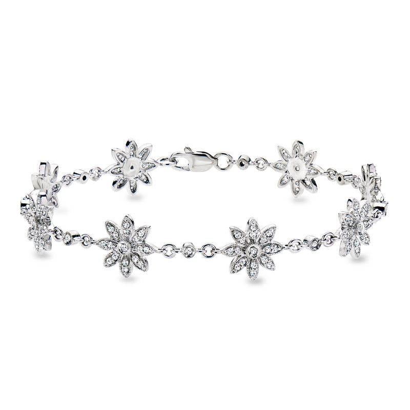 Diamond flower bracelet in white gold with five sparkly cluster motifs and link chain