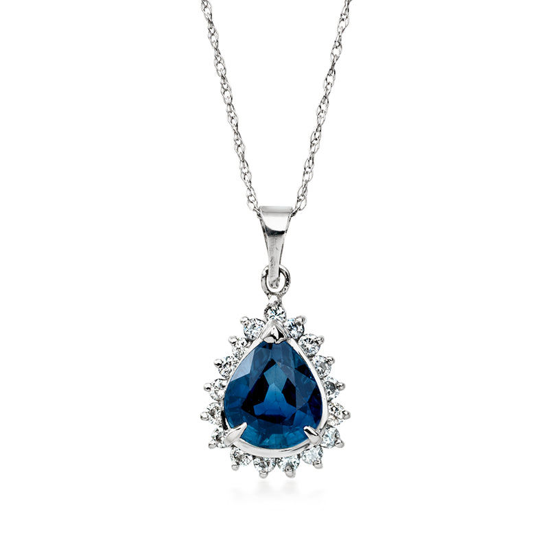 Platinum pendant necklace with oval blue sapphire and diamond halo on chain