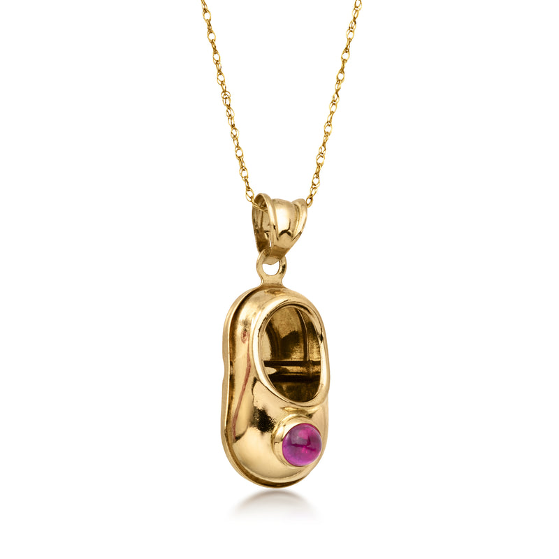 Side-view 14kt yellow gold bootie pendant necklace with purple ruby gemstone