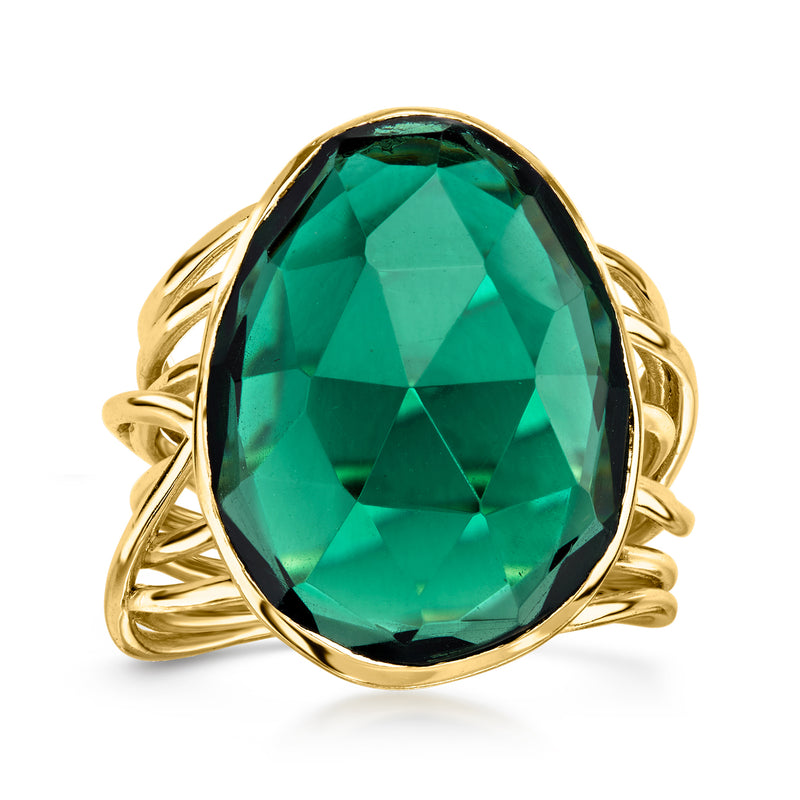 Gold-plated ring with oval green simulated emerald centerpiece and open prong setting