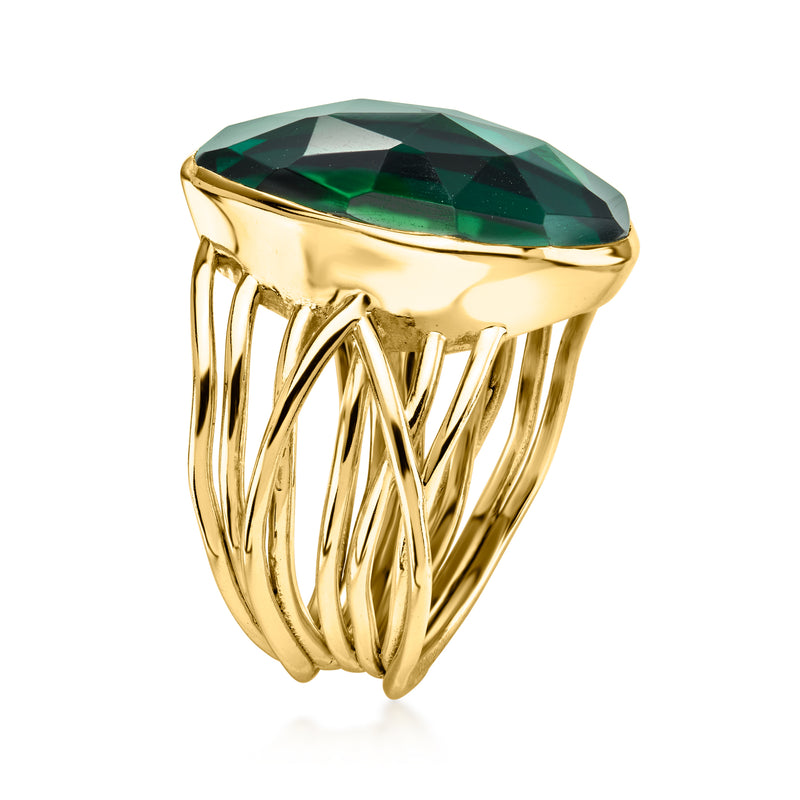 Gold-plated oval green simulated emerald ring with multi-prong band, side view