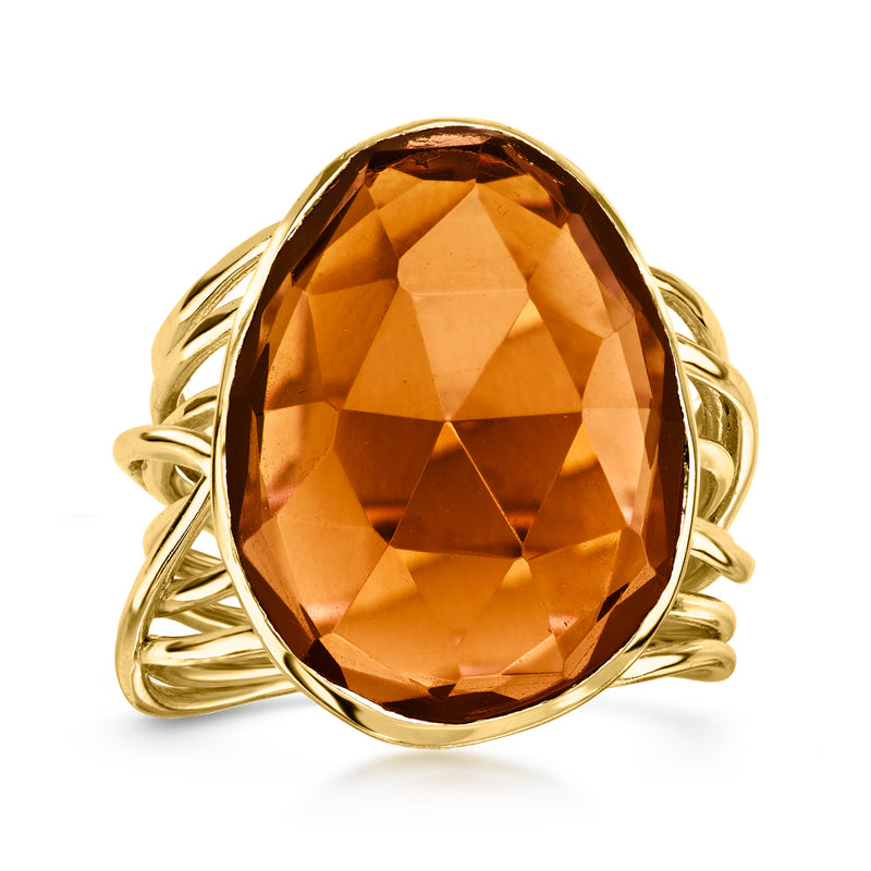 Yellow gold-plated oval ring with faceted brown simulated quartz gemstone setting