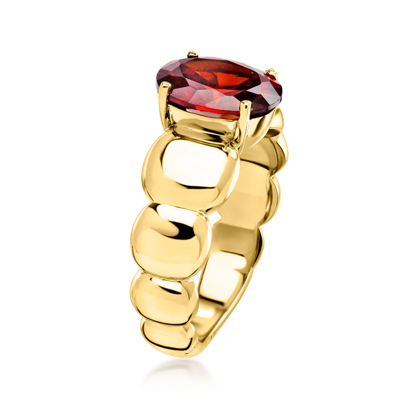 Yellow gold-plated ring with oval red simulated garnet and chunky curved open band