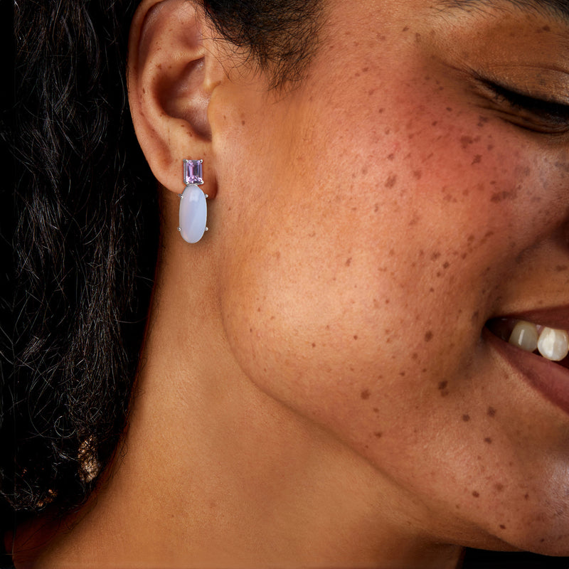Sterling silver drop earrings on-ear: purple amethyst top with pale-blue oval drop