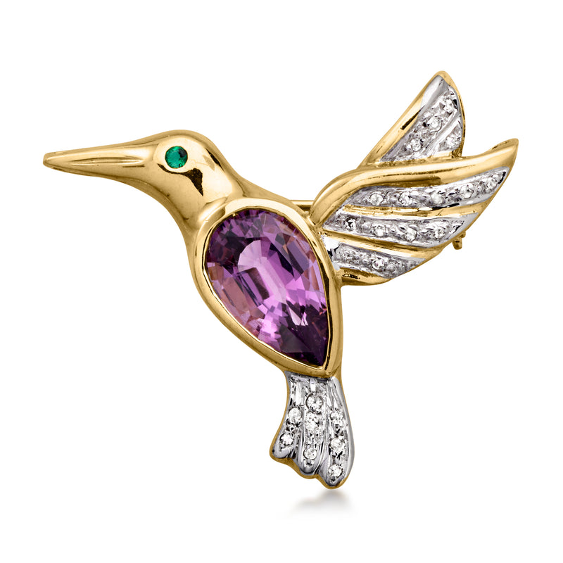 Yellow gold bird pin with purple amethyst body, green emerald eye, diamond wings