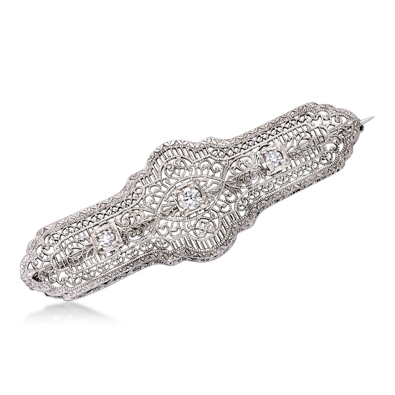 Vintage diamond filigree bar pin in white gold, ornate scrolling design