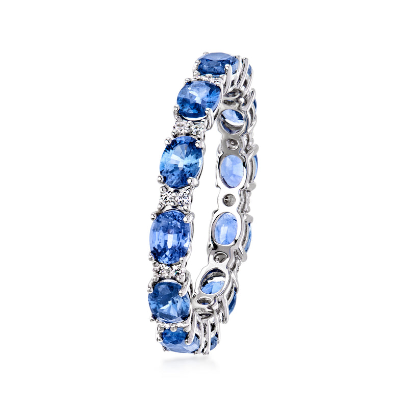 14kt white gold sapphire eternity band with oval blue stones and diamond side details
