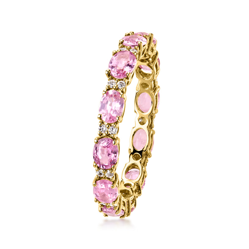 14kt yellow gold eternity band with pink oval sapphires and small diamond highlights