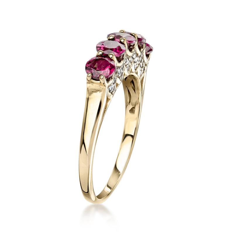 Side view of 10kt yellow gold ring with pink rhodolite gemstones and diamond detail
