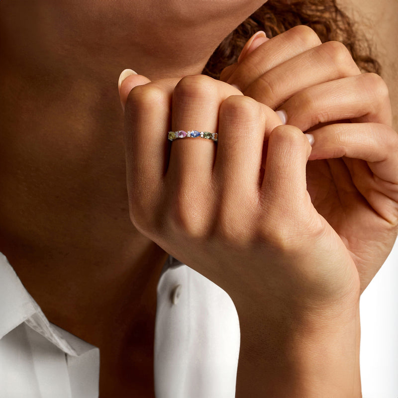 14kt yellow gold sapphire and diamond ring worn on finger, multicolor stones