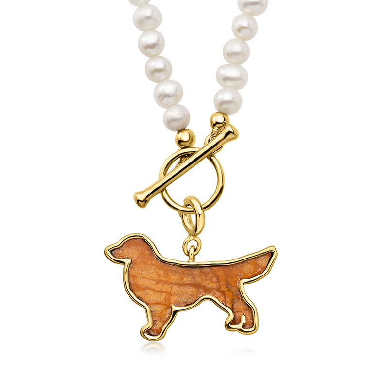 Gold dog charm with brown jasper inlay on white pearl necklace strand