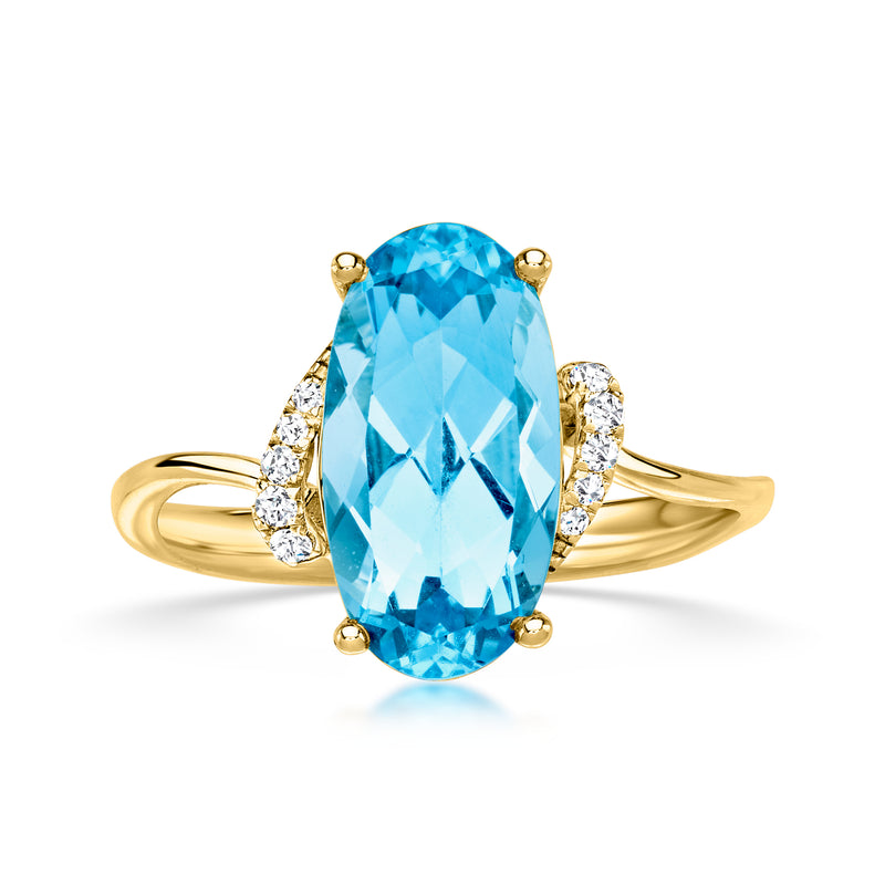Oval blue topaz ring in 14kt yellow gold with diamond side stones