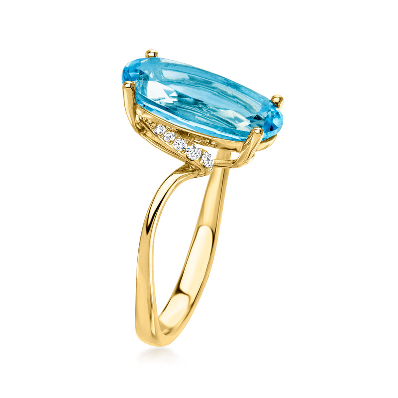 Teardrop blue topaz ring in 14kt yellow gold with diamond band details