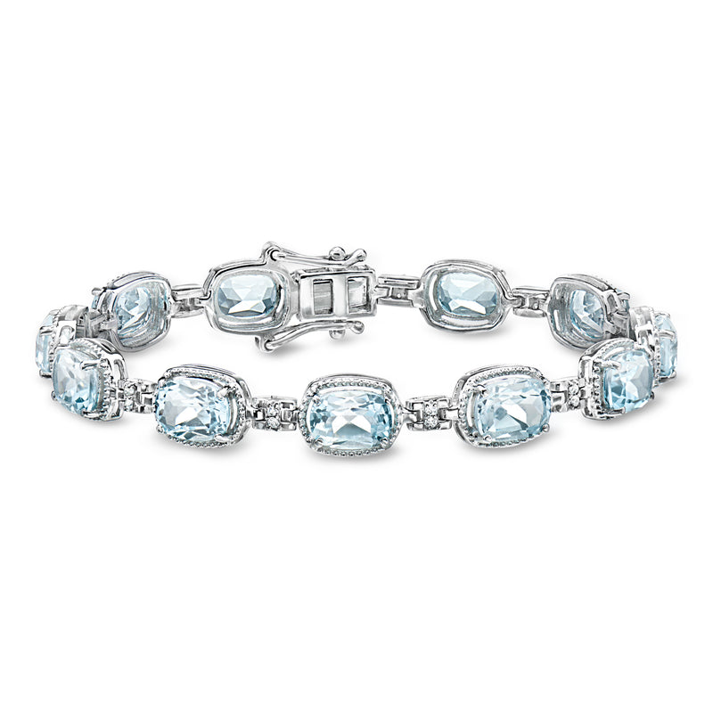 Sky blue topaz tennis bracelet with white accents, oval stones in sterling silver