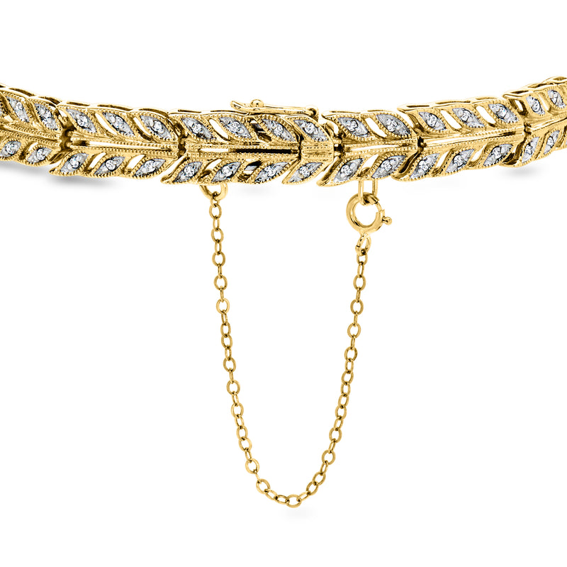 Vintage diamond leaf bracelet in 14kt yellow gold with safety chain