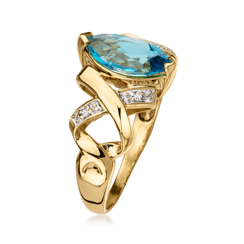 Oval blue topaz ring in 14kt yellow gold with diamond side stones, angled view