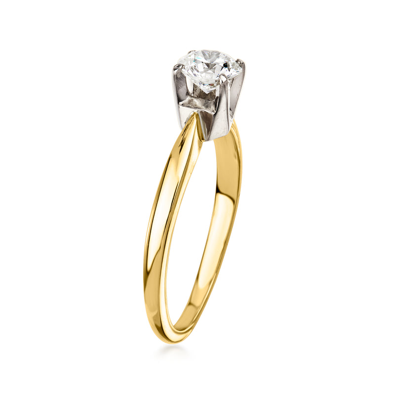 Side view of a vintage 18k yellow gold diamond ring with round prong-set center stone.