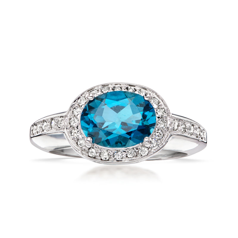 Oval blue topaz and diamond halo ring in 14kt white gold, vintage style